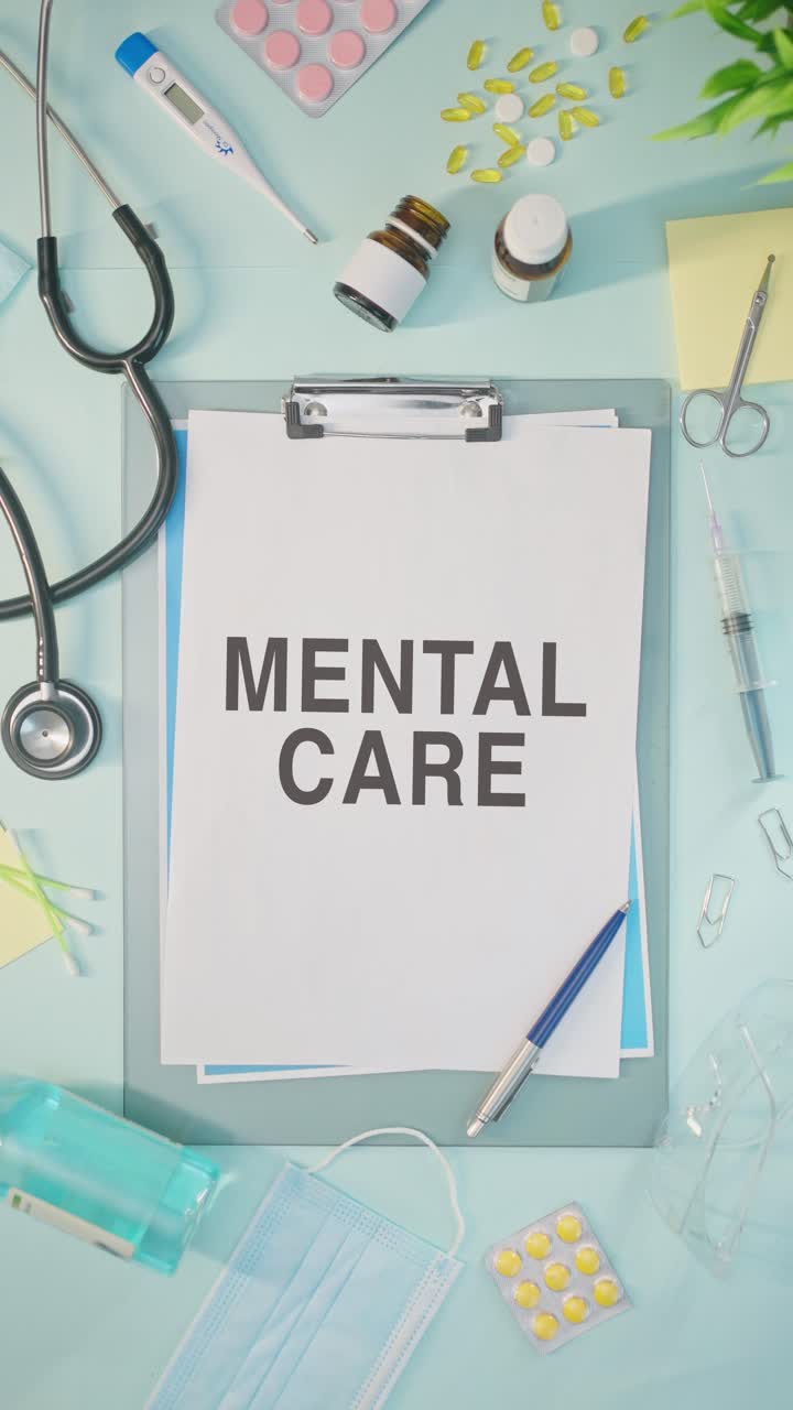 VERTICAL VIDEO OF MENTAL CARE WRITTEN ON MEDICAL PAPER