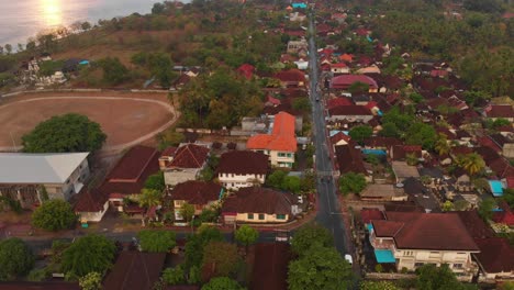 tilt up shot of town at nusa penida indonesia during sunrise