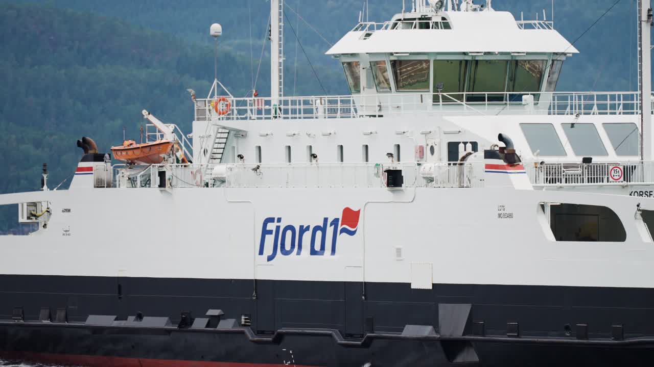A close-up shot of the passenger ferry crosses the fjord.