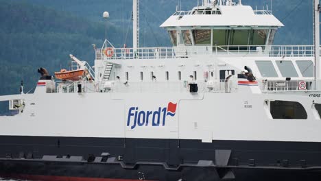 a close-up shot of the passenger ferry crosses the fjord.