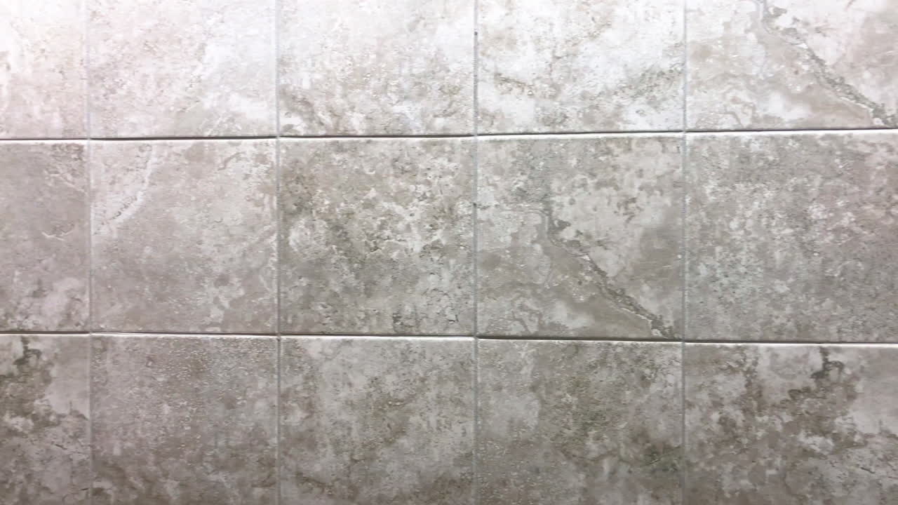Square tiles inside bathroom on wall or floor