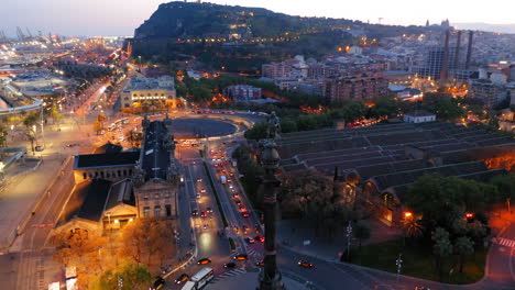 aerial view of christopher columbus statue and harbour of barcelona at night, spain