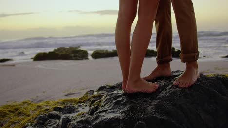 filming a couple on a beach on a digital camera 4k