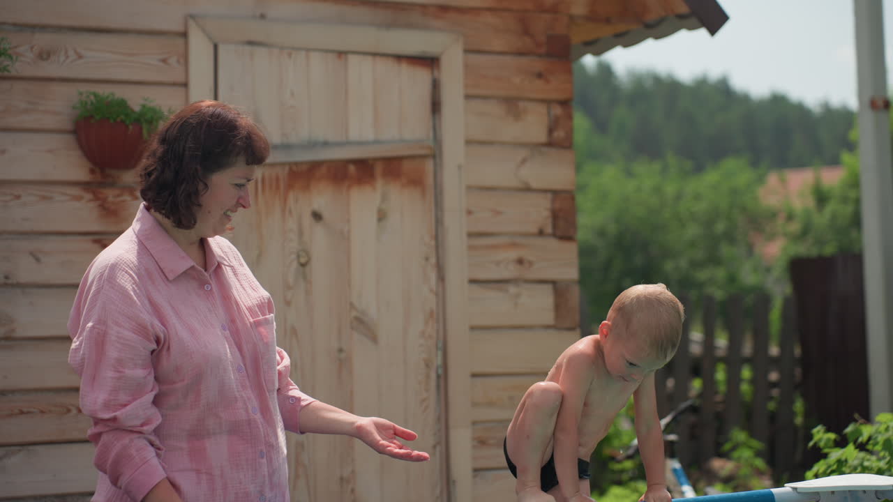 Encouragement To Jump, Child Prepares To Dive In Water, Encouraging Child To Take Leap Into Pool Confidently, Parent Gently Persuades Young One To Jump Into Water Confidently Amid Warm Afternoon