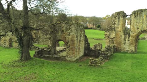 basingwerk abbey landmark medieval abandoned welsh ruins aerial view dolly right forwards