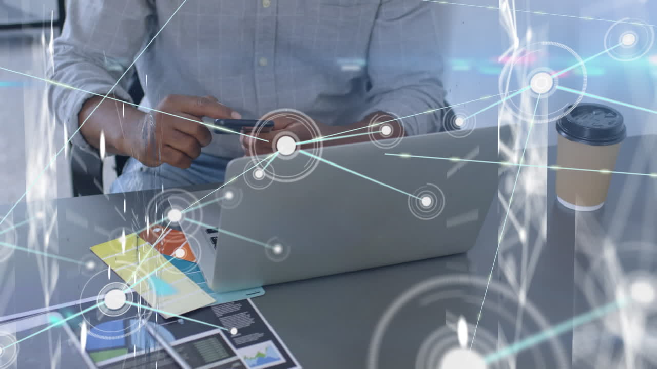 Animation of network of connections over biracial businessman in office