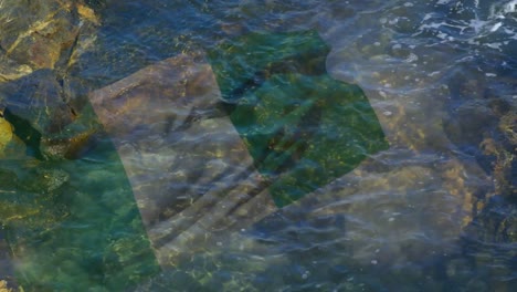 Animación-De-La-Bandera-De-Los-Estados-Unidos-De-América-Ondeando-Sobre-El-Mar-En-Rockpool.