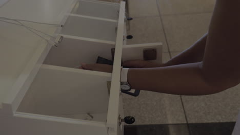 woman leaving cellphone in locker for charging