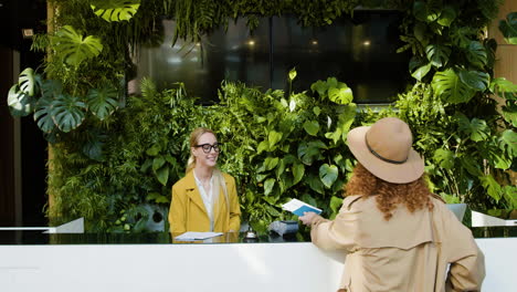 Blonde-receptionist-working-in-a-hotel