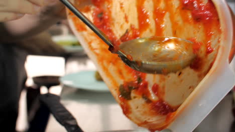 Chef-preparing-ravioli-with-sauce-in-restaurant,-close-up,-Mediterranean