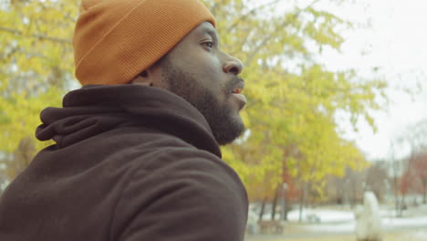 black man jogging in park