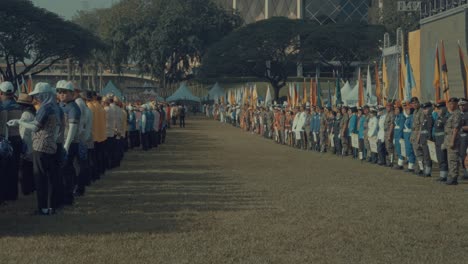 large group of people in uniform at an outdoor ceremony