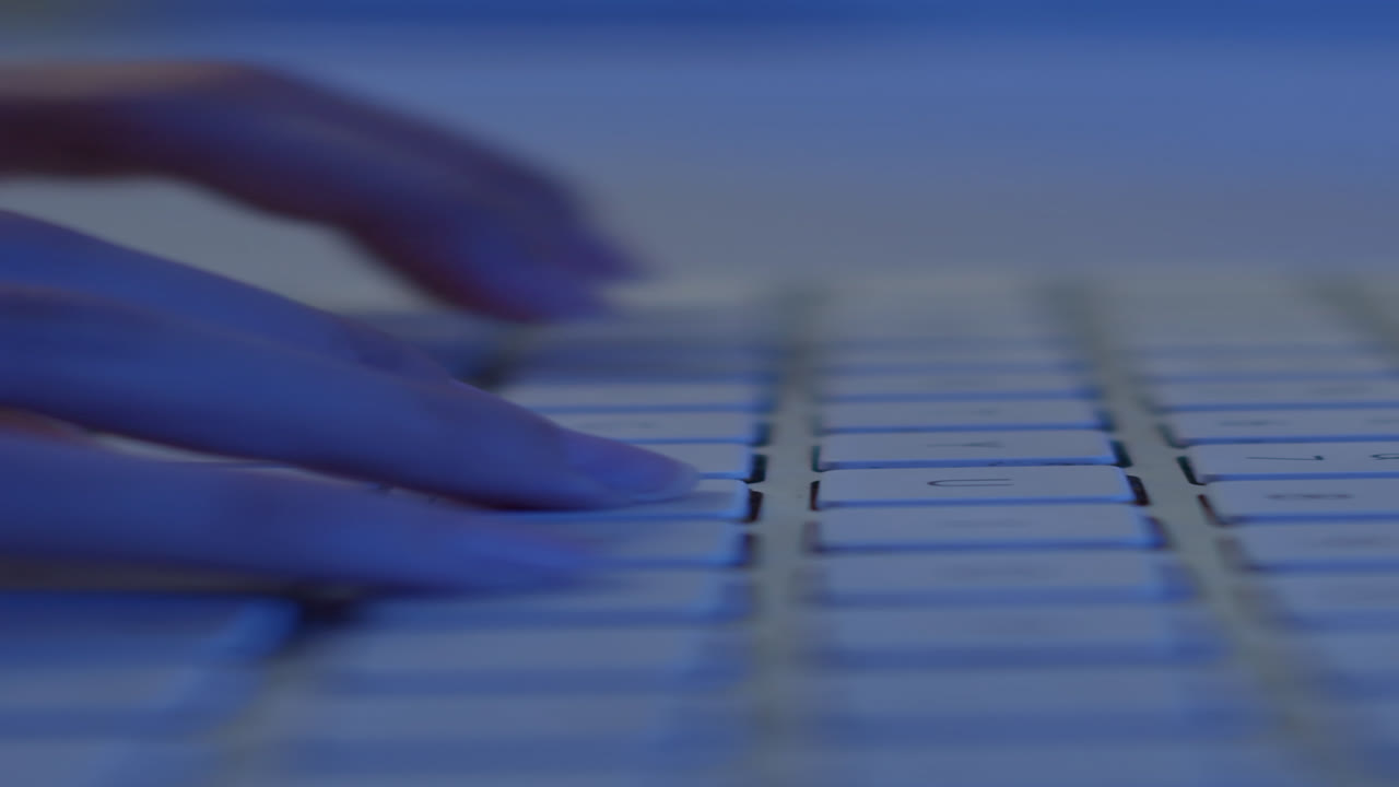 Unrecognizable Person Coding, Using Keyboard on Laptop