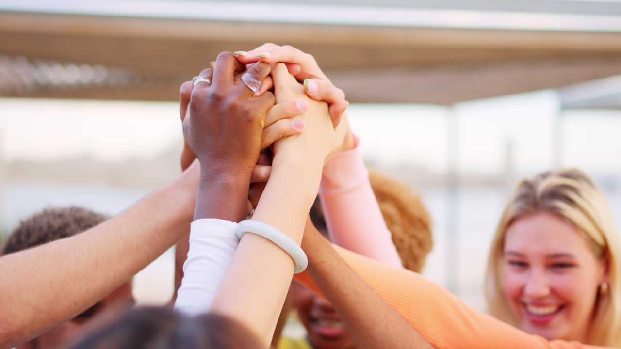 Diverse group celebrating together with hands in