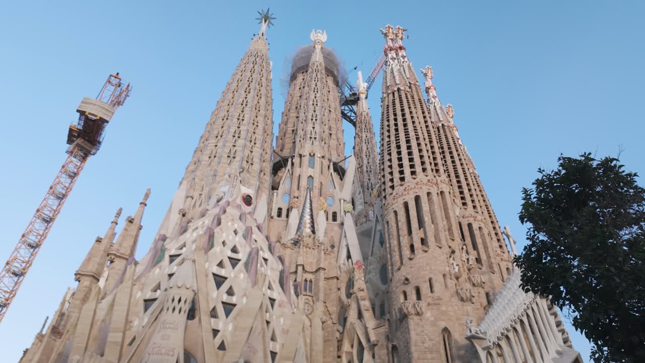 A breathtaking view of La Sagrada Familia in Barcelona under a clear blue sky