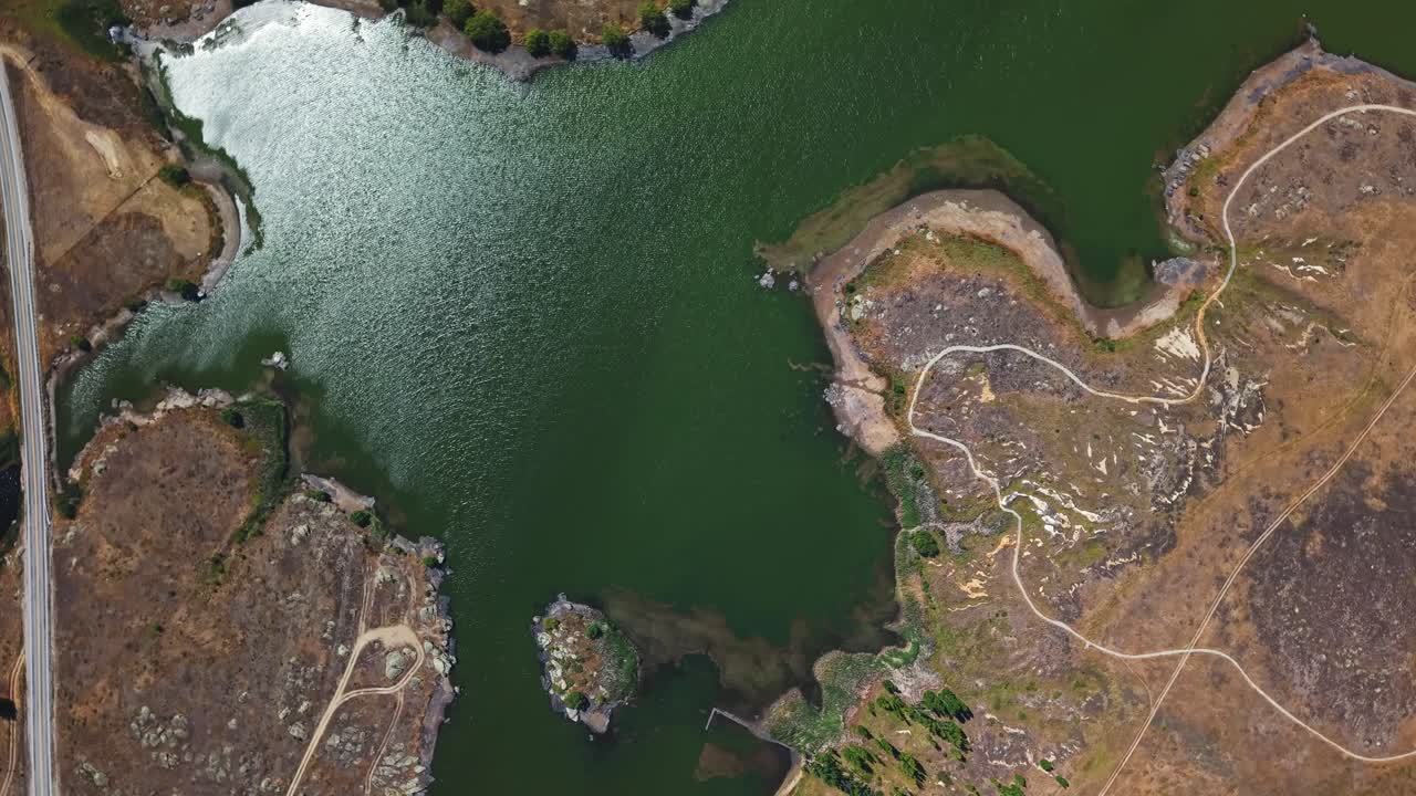 Aerial View of a Lake with Islands and Winding Paths