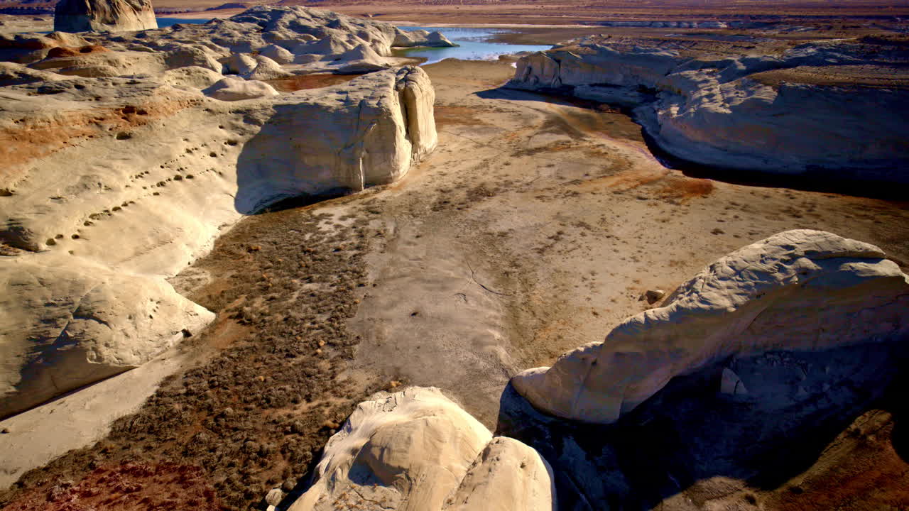 Drone view of the Southwest captures a surreal patchwork of color and abstract land formations.