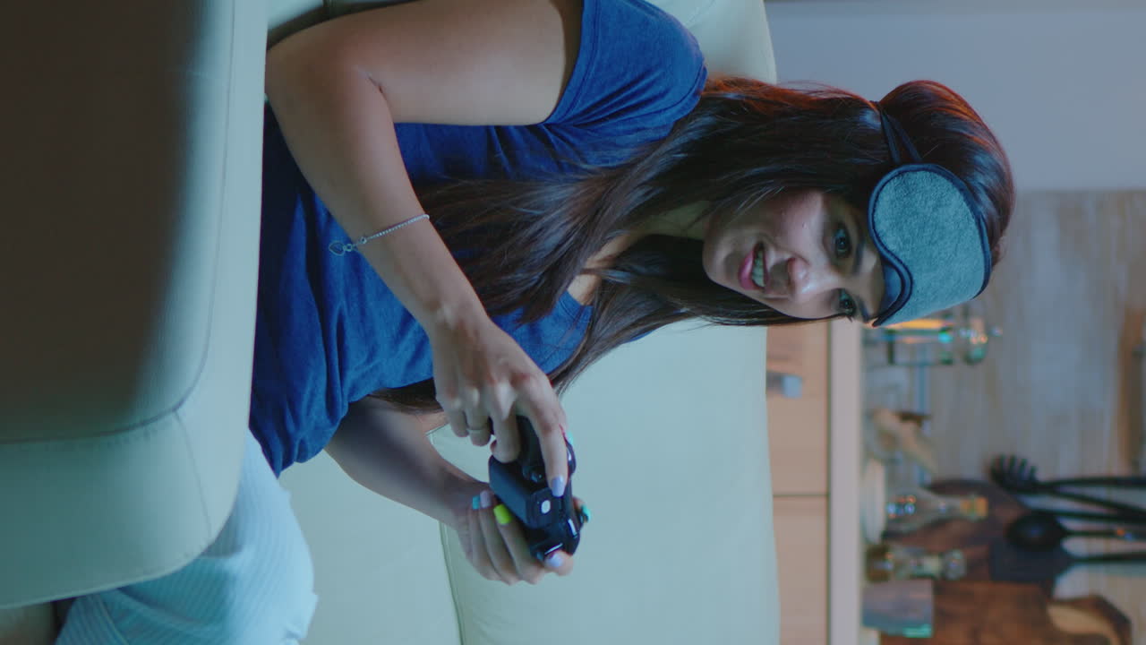 Vertical Video: Determined Woman Playing Video Game