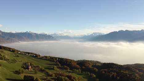 flying high over farm fields revealing vevey, montreux and lake léman below the mist, sunset light