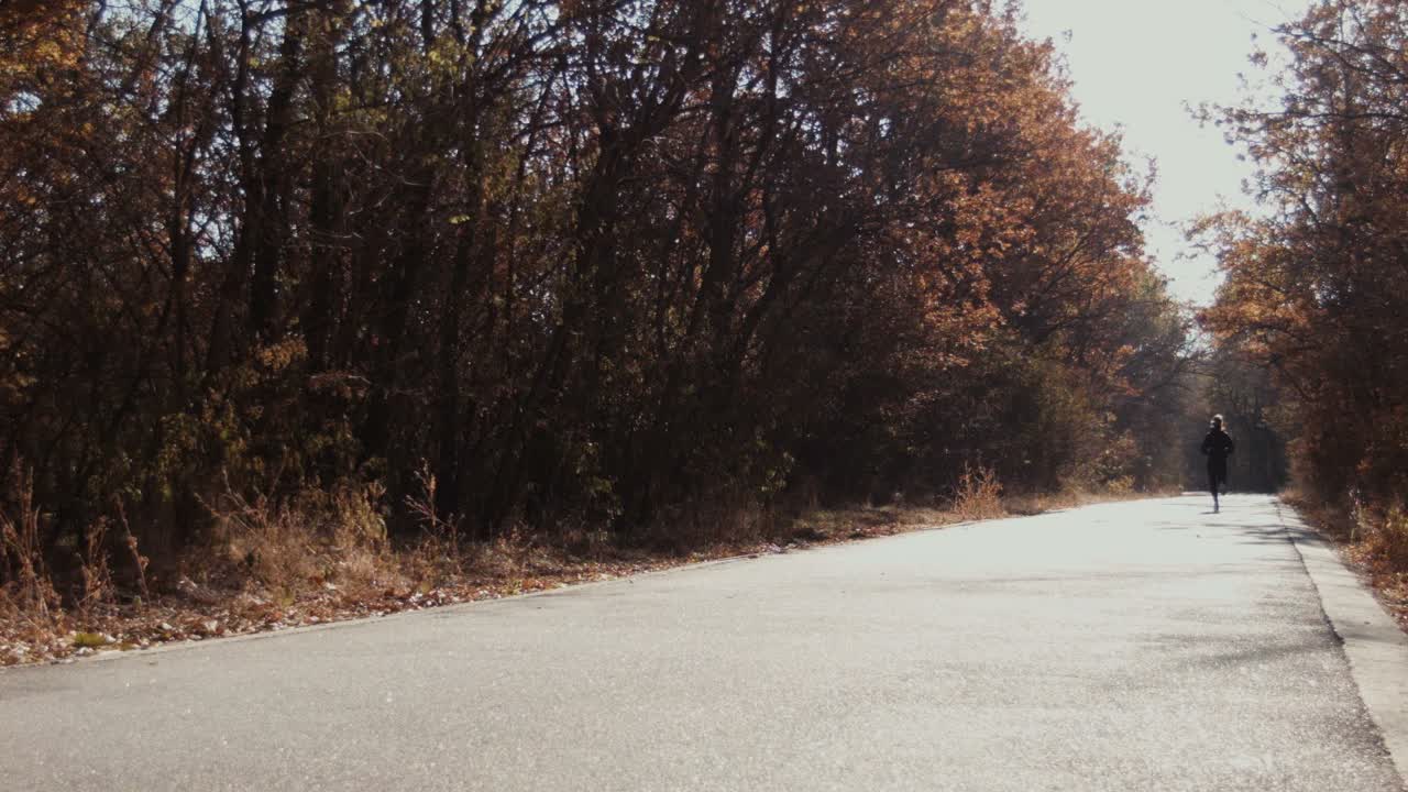 Girl Runs and Laughs with Bouquet Leaves in Autumn Park Child Plays Outdoors