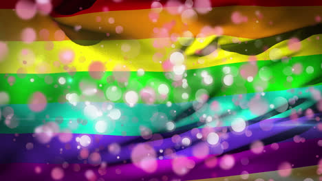 animation of rainbow flag waving with white and pink flickering spots