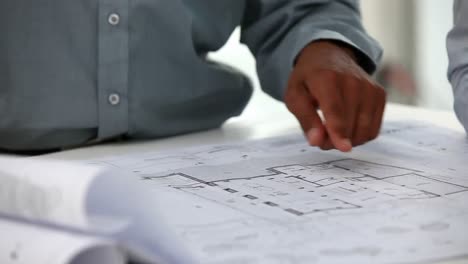 architect shows a plan