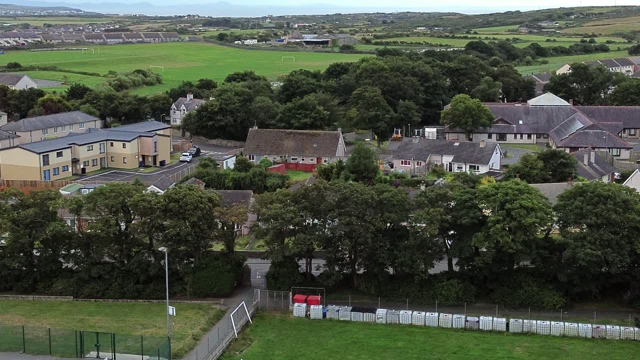 Holyhead town suburb aerial view looking over community sports fields and neighbourhood houses