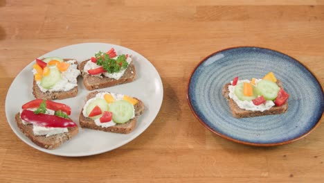 showing two ceramic plates: one with four delicious sandwiches, second with one colorful sandwich