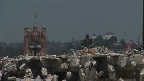 pigeons walk on a pile of rubble