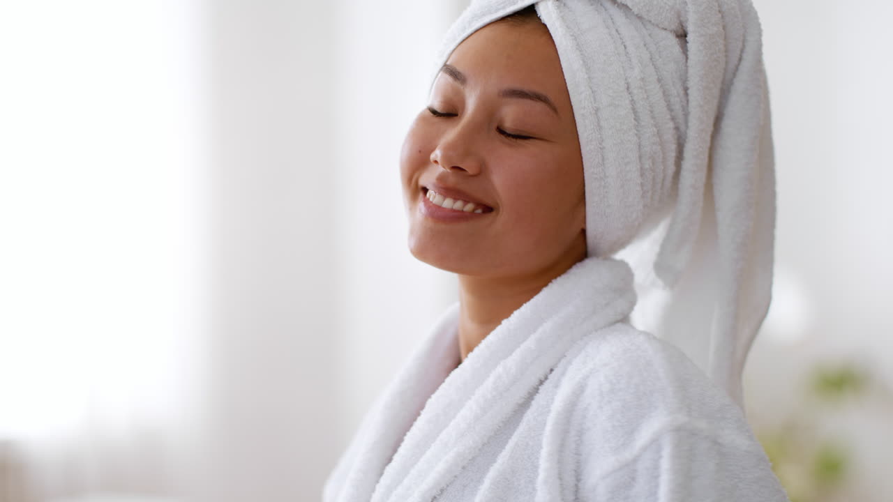 Woman in bathrobe after a shower or bath