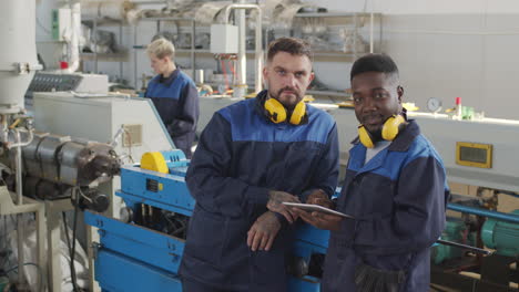 portrait of plant workers looking at camera
