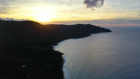 stunning aerial footage reveals soft pastel skies over the usvi, with st. croix’s forested peninsula glowing beneath colorful clouds and the ocean shimmering gently below