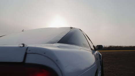 white car drifting in daylight