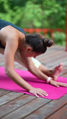 woman practicing yoga outdoors