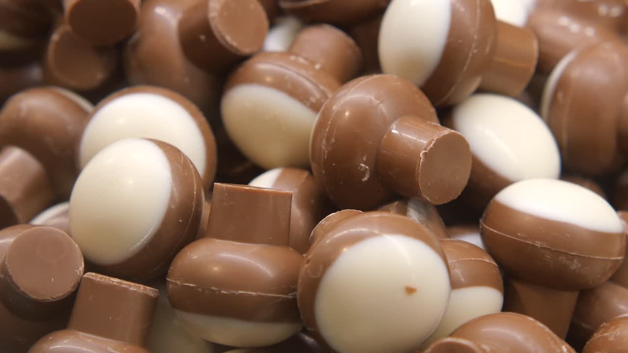 A pile of milk and white chocolate mushroom candies