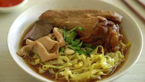 egg noodles with stewed and braised duck in brown soup - asian food style-1