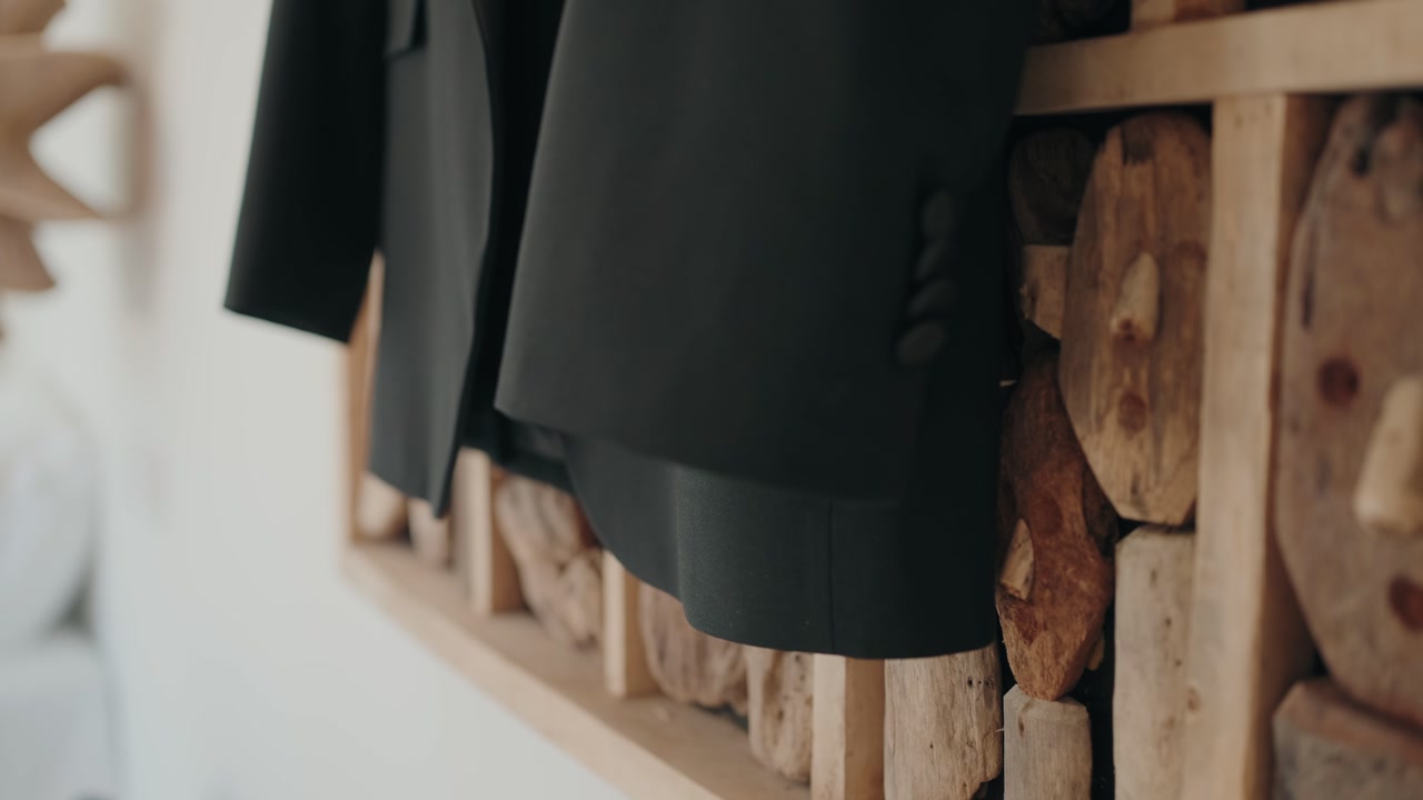 Elegant close up of groom suit jacket prepared for wedding ceremony