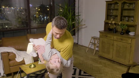 Top-View-Of-Father-And-Daughter-Playing-In-The-Living-Room-At-Home