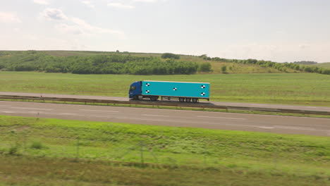 truck on highway through scenic countryside