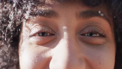 close up portrait of female african american basketball player eyes, in slow motion