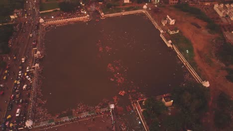 Drone-shot-of-ancient-water-tank-during-an-Indian-festival-at-Gwalior-,-India