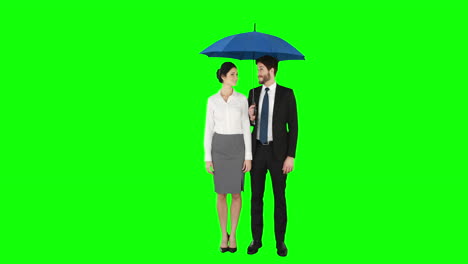 business people standing under umbrella