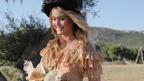 Boho-style-bride-entering-elopement-scene-in-mediterranean-golden-field---Close-up-tracking-shot