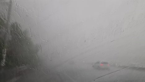 Heavy-rain,-hail-and-flooding-while-pulled-over-on-the-Auckland-highway-in-New-Zealand