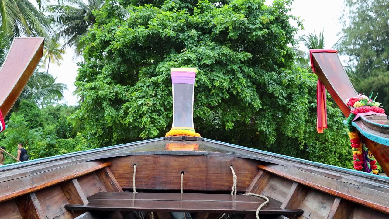 Wooden Longtail Boat at a Tropical Pier