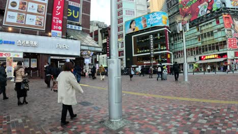 pedestrians crossing at a busy city junction