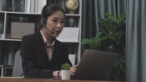 enthusiastic businesswoman utilizing laptop for video conference.