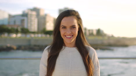 A-happy-young-woman-smiling-on-the-promenade