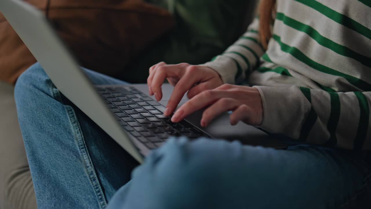 Portrait smiling woman earphones typing laptop surfing internet on home weekend.