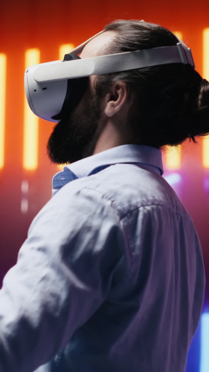 Vertical Video Young cool person having fun under the neon lights with VR tech tools